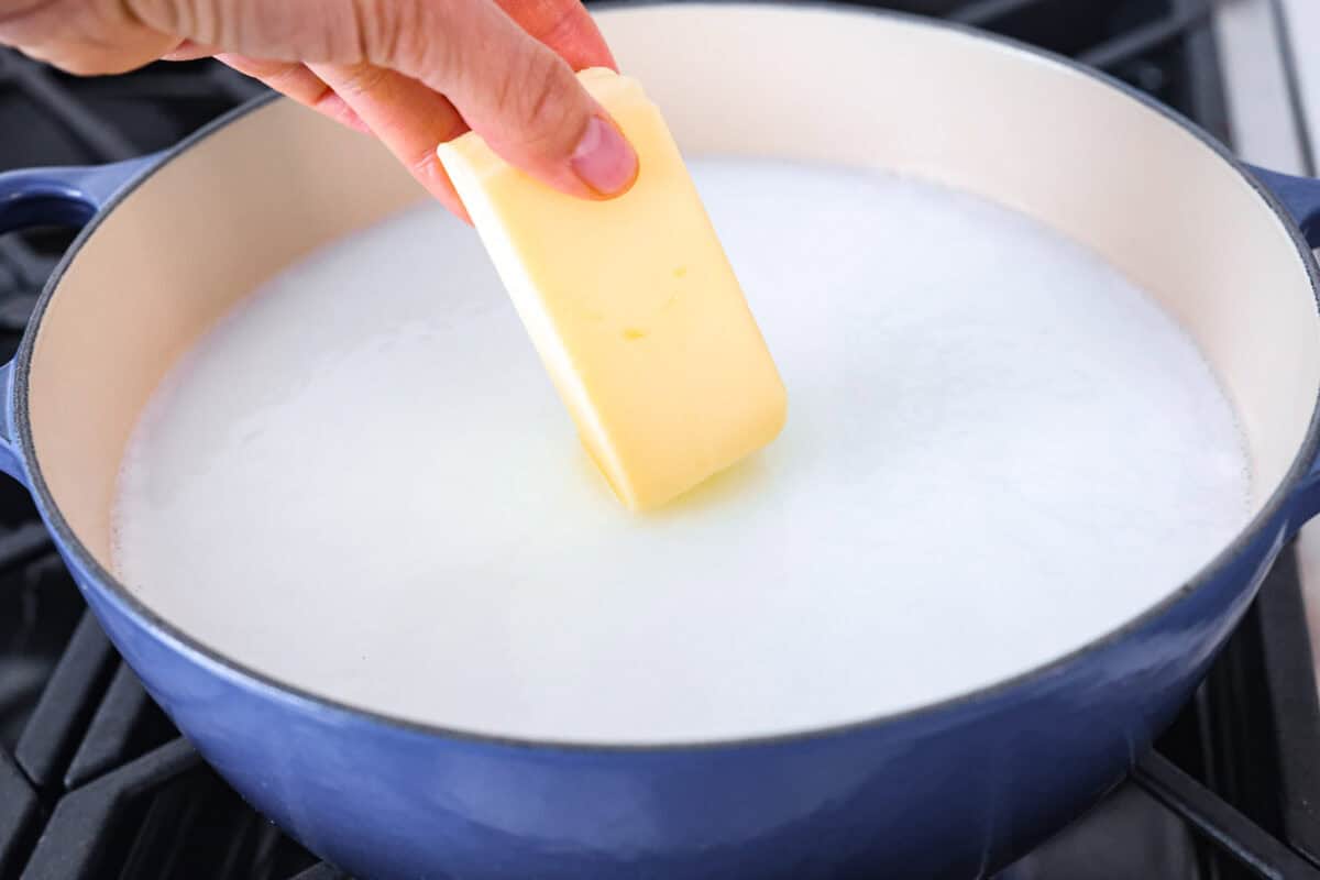 Third photo of the butter adding to the pot.