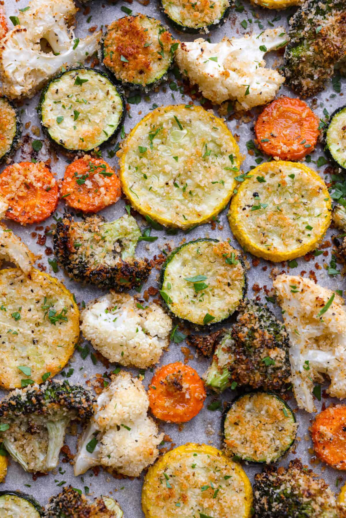 Close up shot of browned parmesan roasted vegetables. 