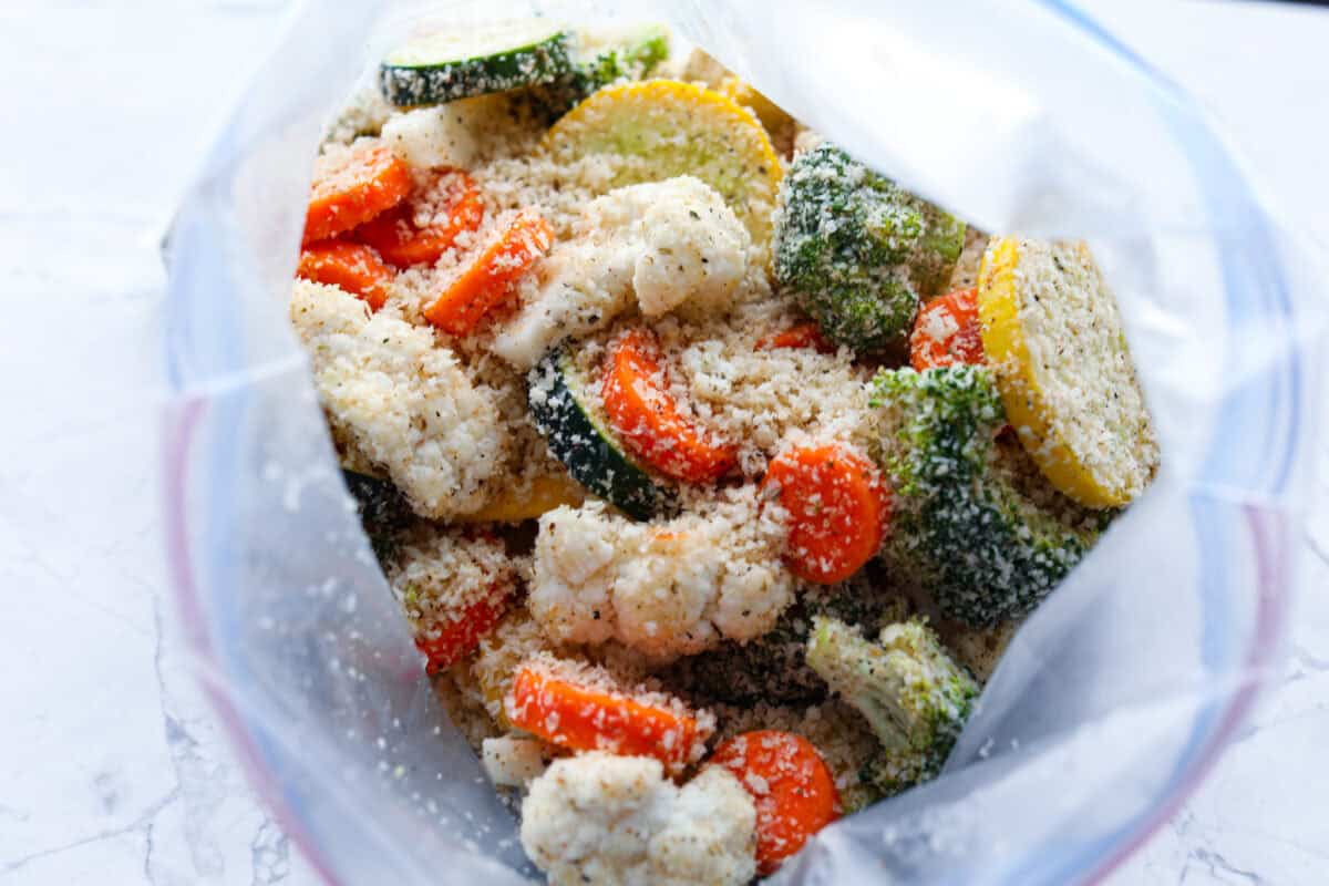 Overhead shot of vegetables and breading in a ziplock bag. 