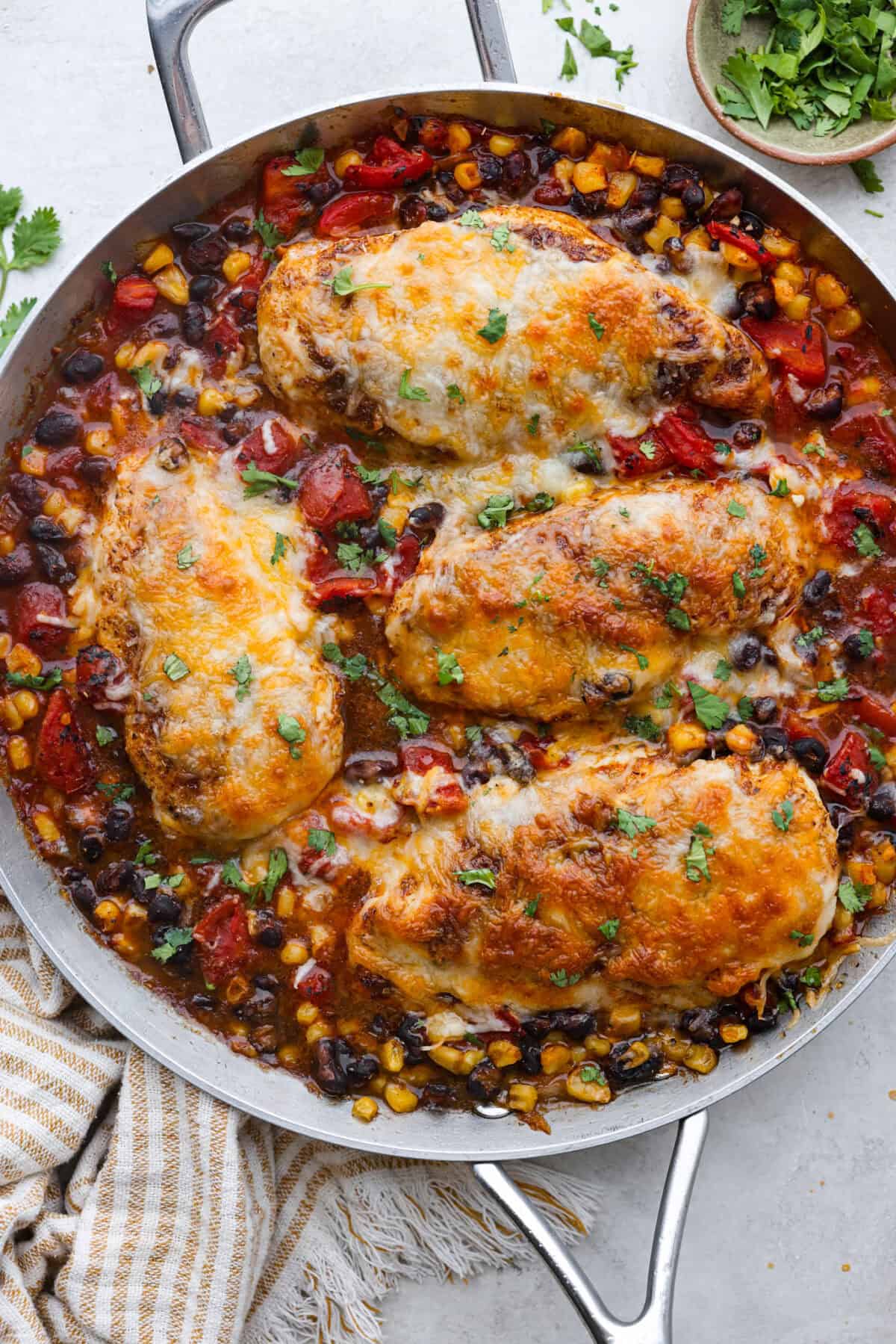 Overhead shot of cowboy chicken in a skillet. 