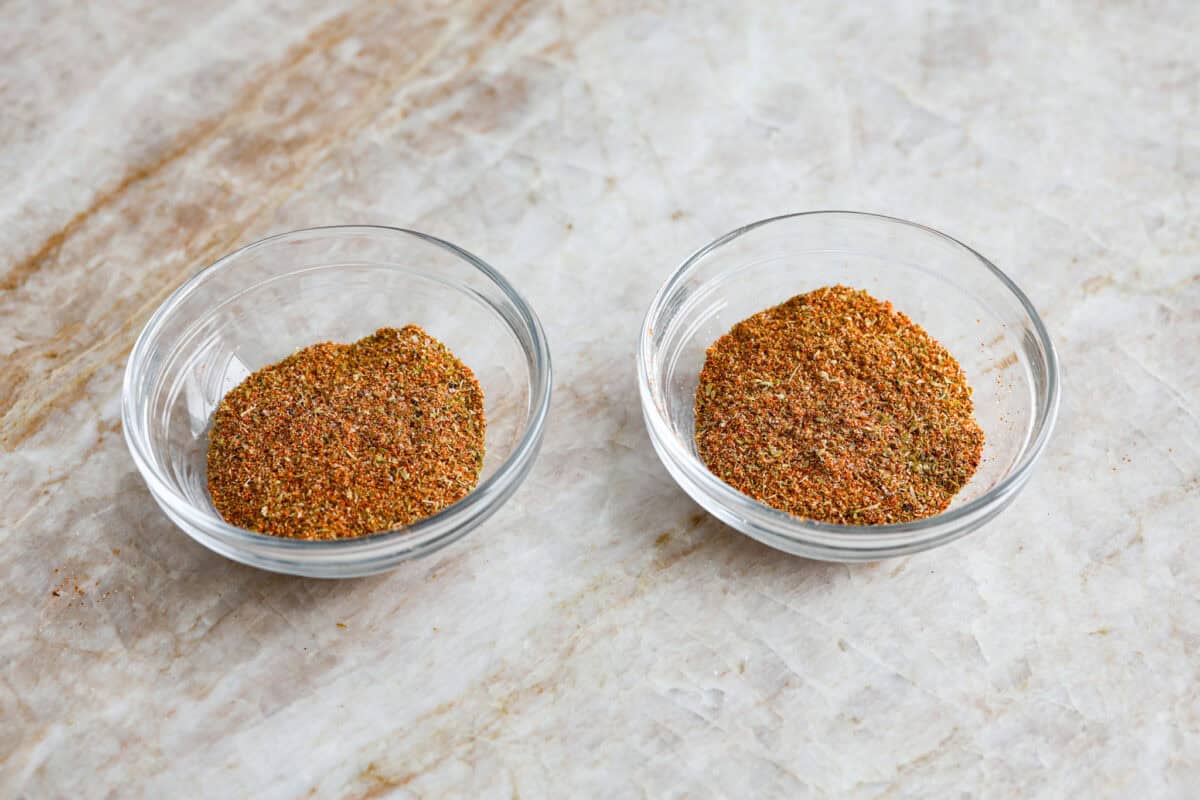 Overhead shot of the seasoning mixture split in to two bowls.