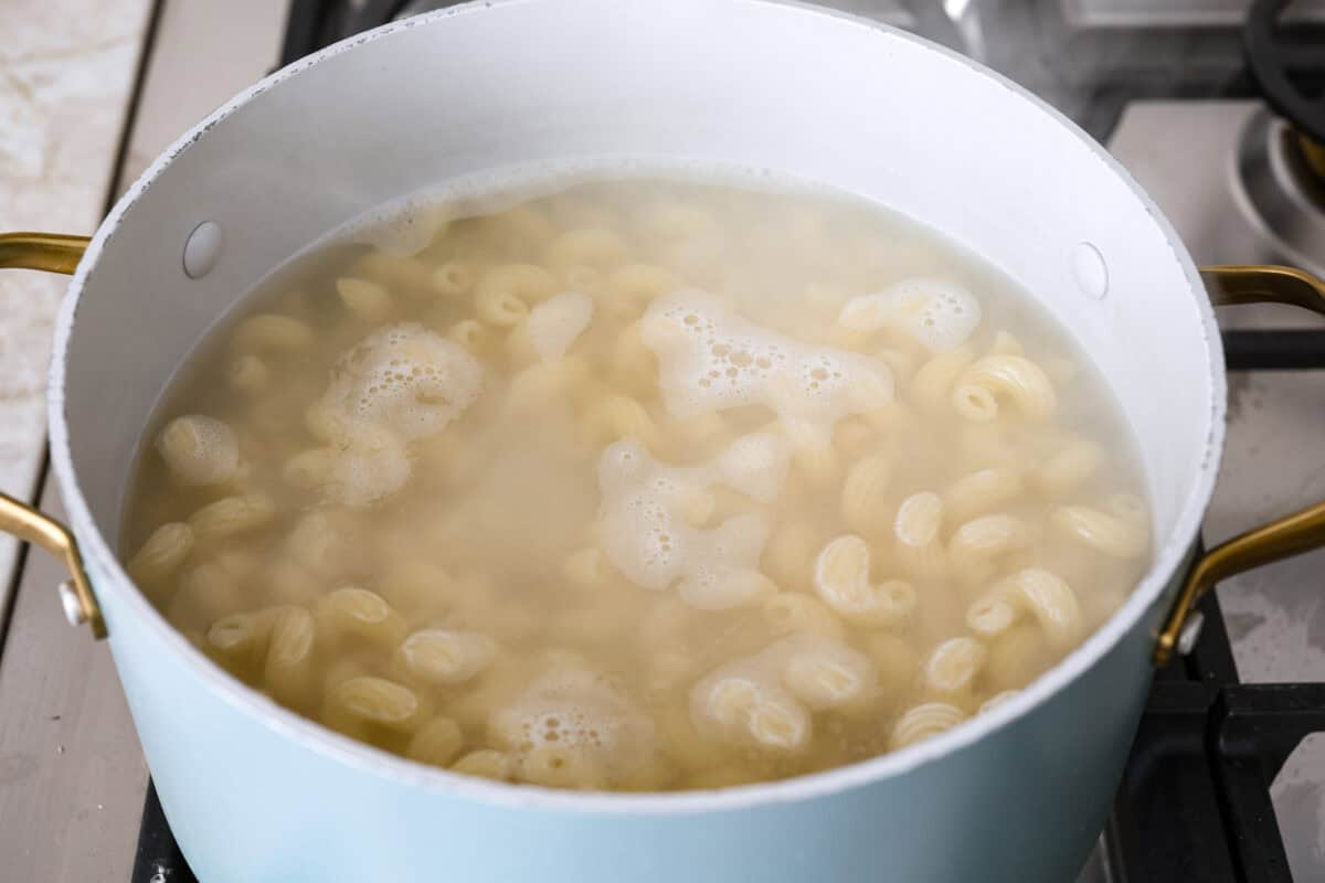 Angle shot of pasta cooked in boiling water. 