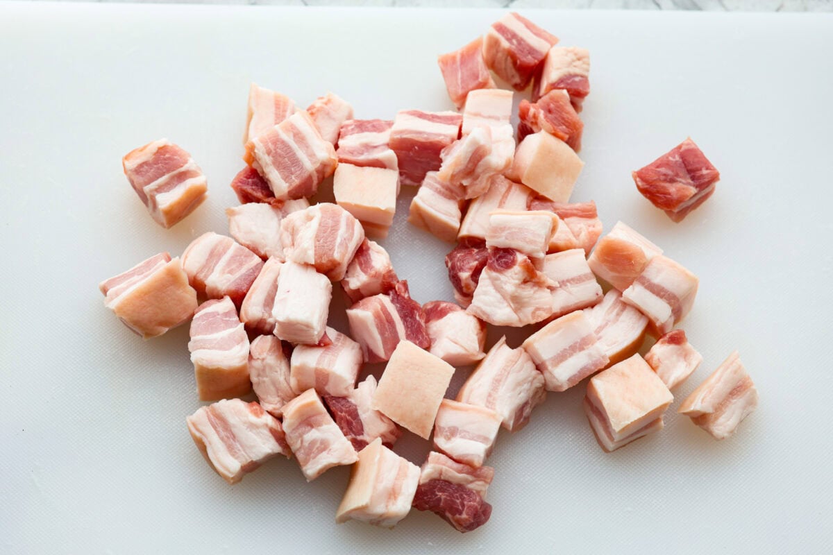 Overhead shot of pork belly cut into 1 inch pieces. 