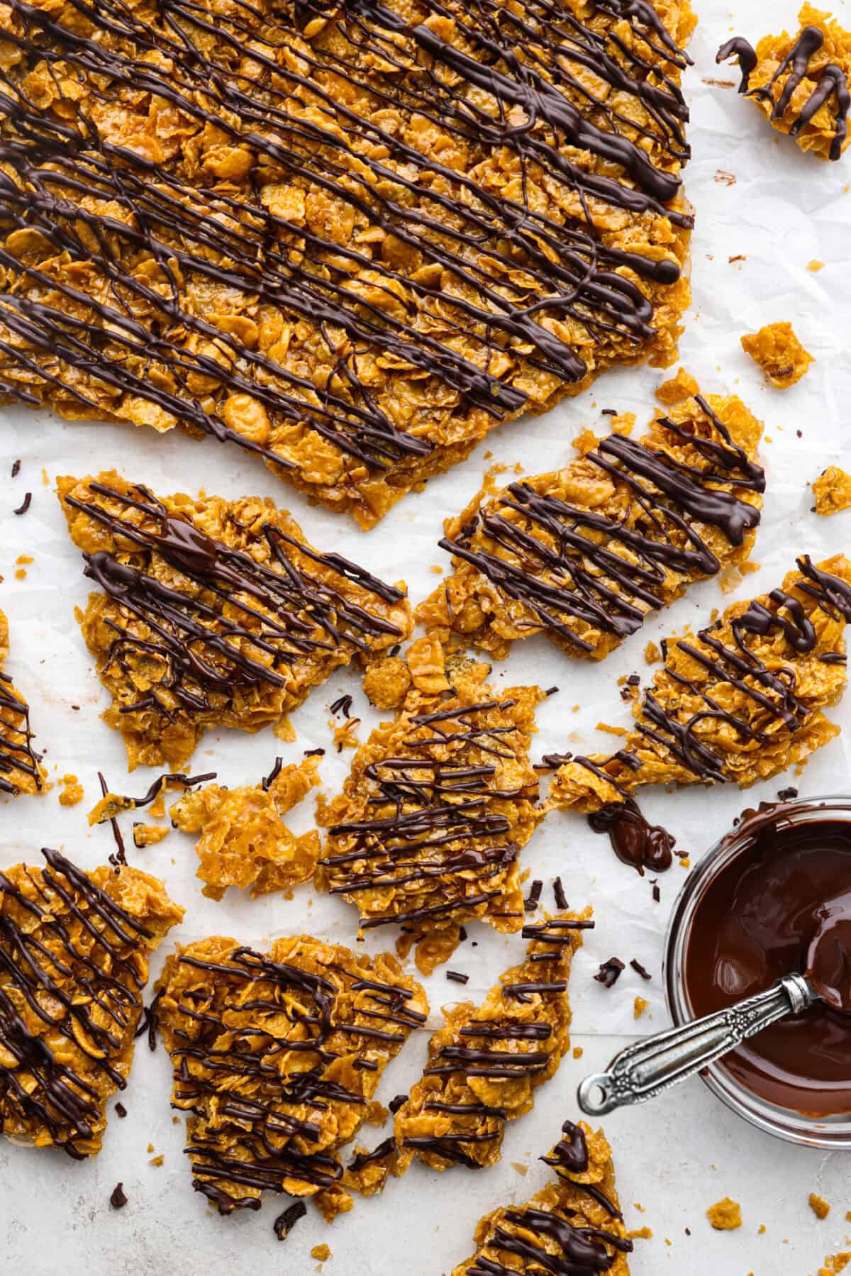 Overhead shot of crunched up pieces of cornflake brittle crack. 