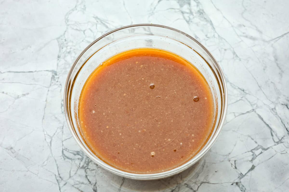 Overhead shot of sauce mixed together in a glass bowl. 