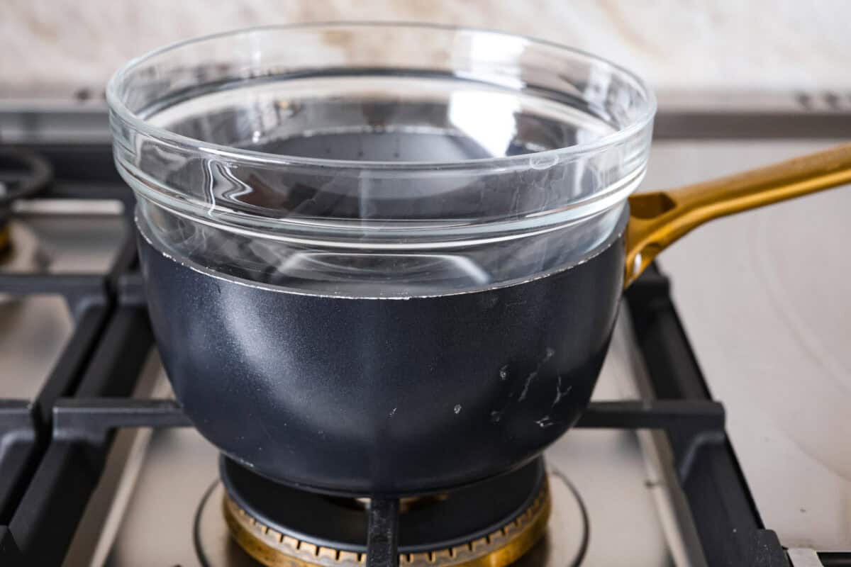 Second photo of a glass bowl placed on top of the pot of water.