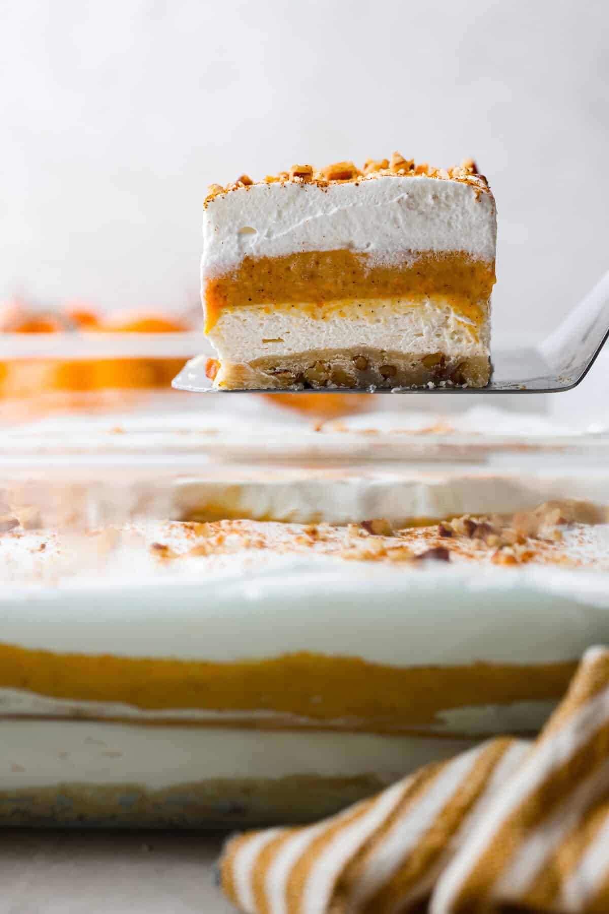 Close view of a slice of pumpkin delight lifting from the pan.