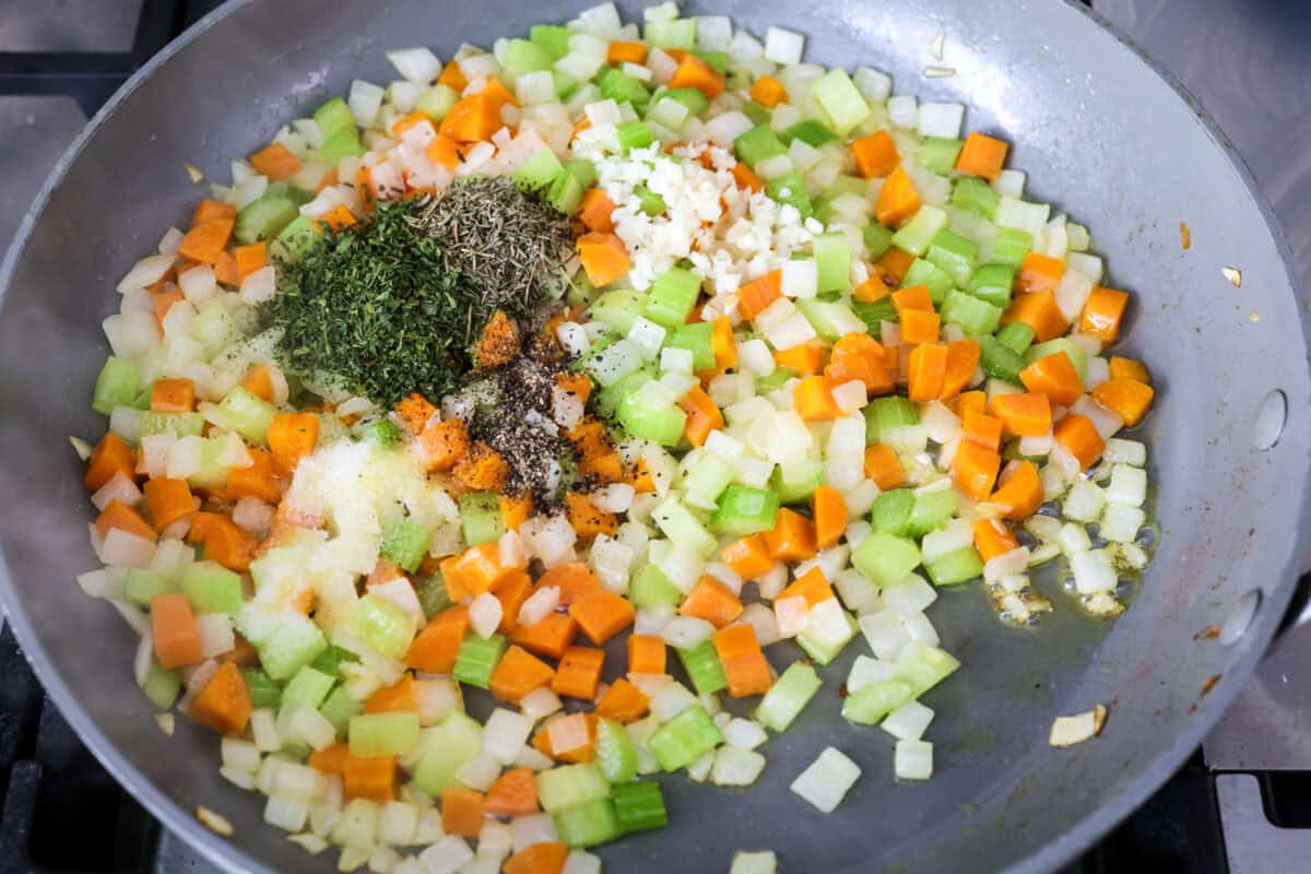 Overhead shot of cooked veggies with seasonings on top. 