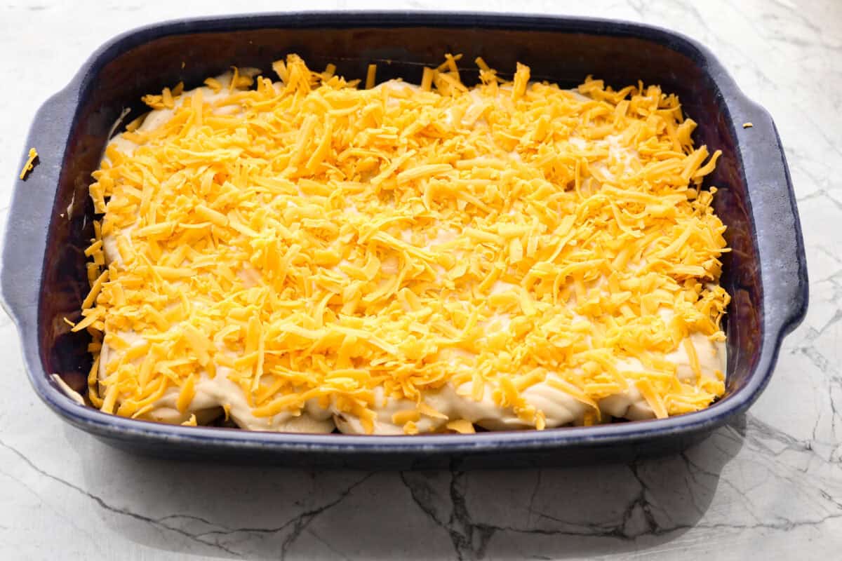 Overhead shot of first three layers of casserole in the baking dish. 