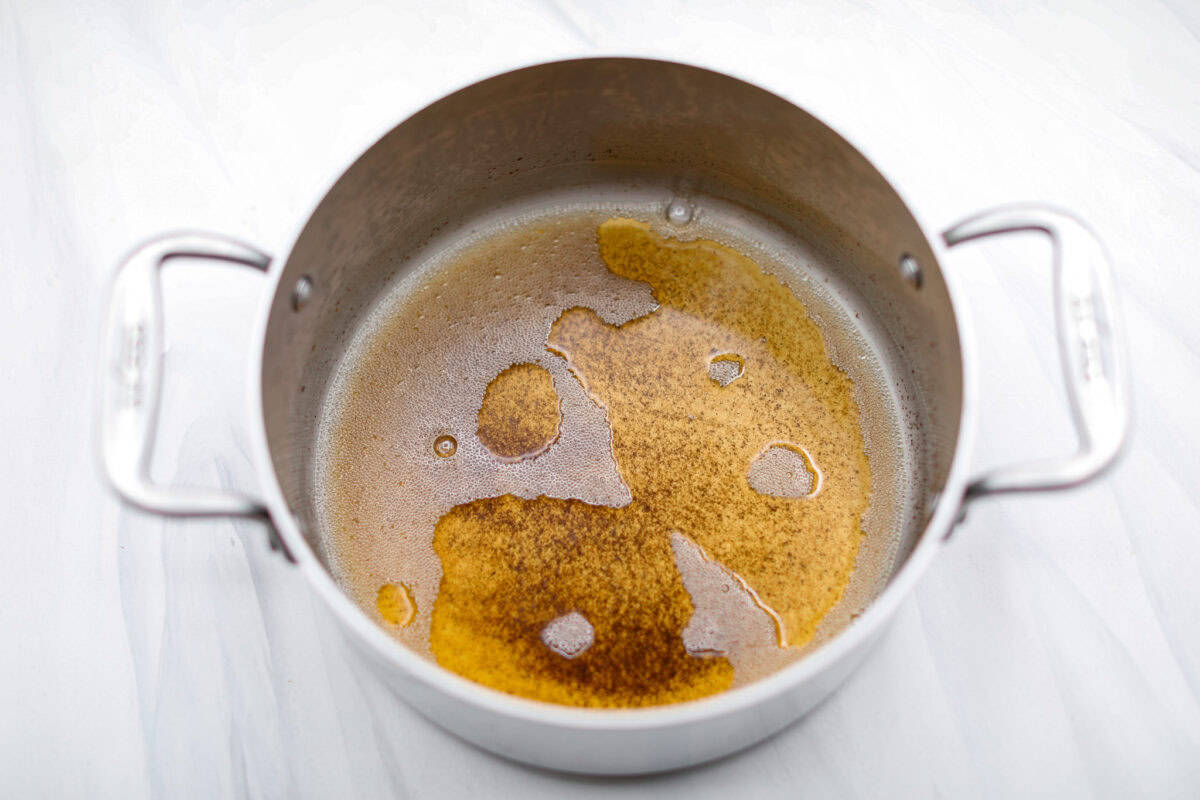 Overhead shot of browned butter in a pot. 