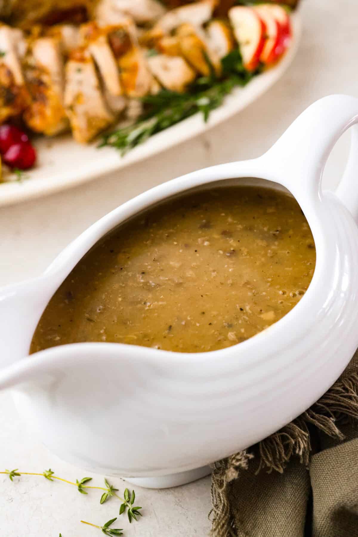 Angle shot of giblet gravy in a gravy boat. 