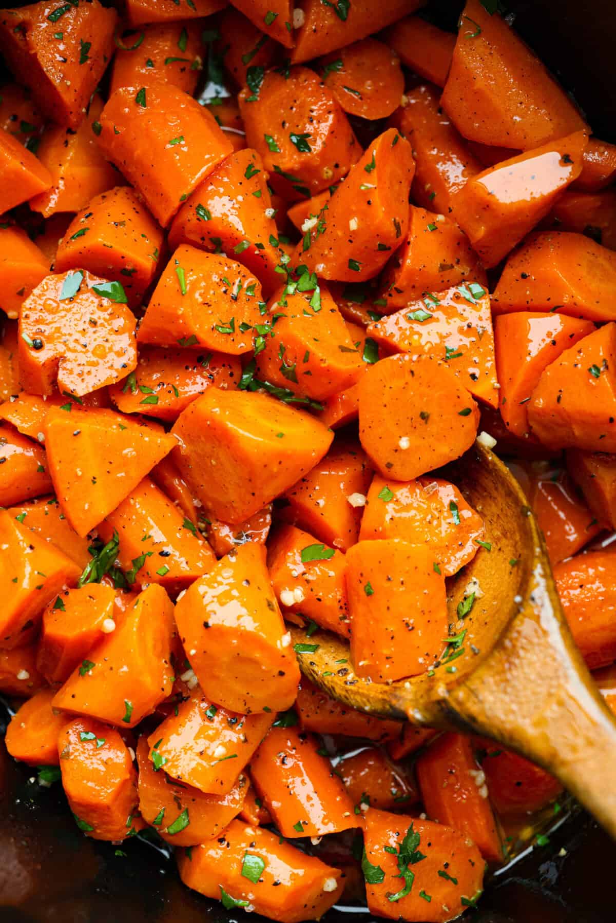 Close up shot of crockpot carrots. 