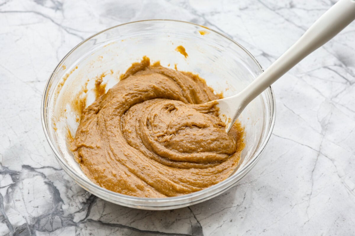 Overhead shot of bread batter mixed together in a mixing bowl. 