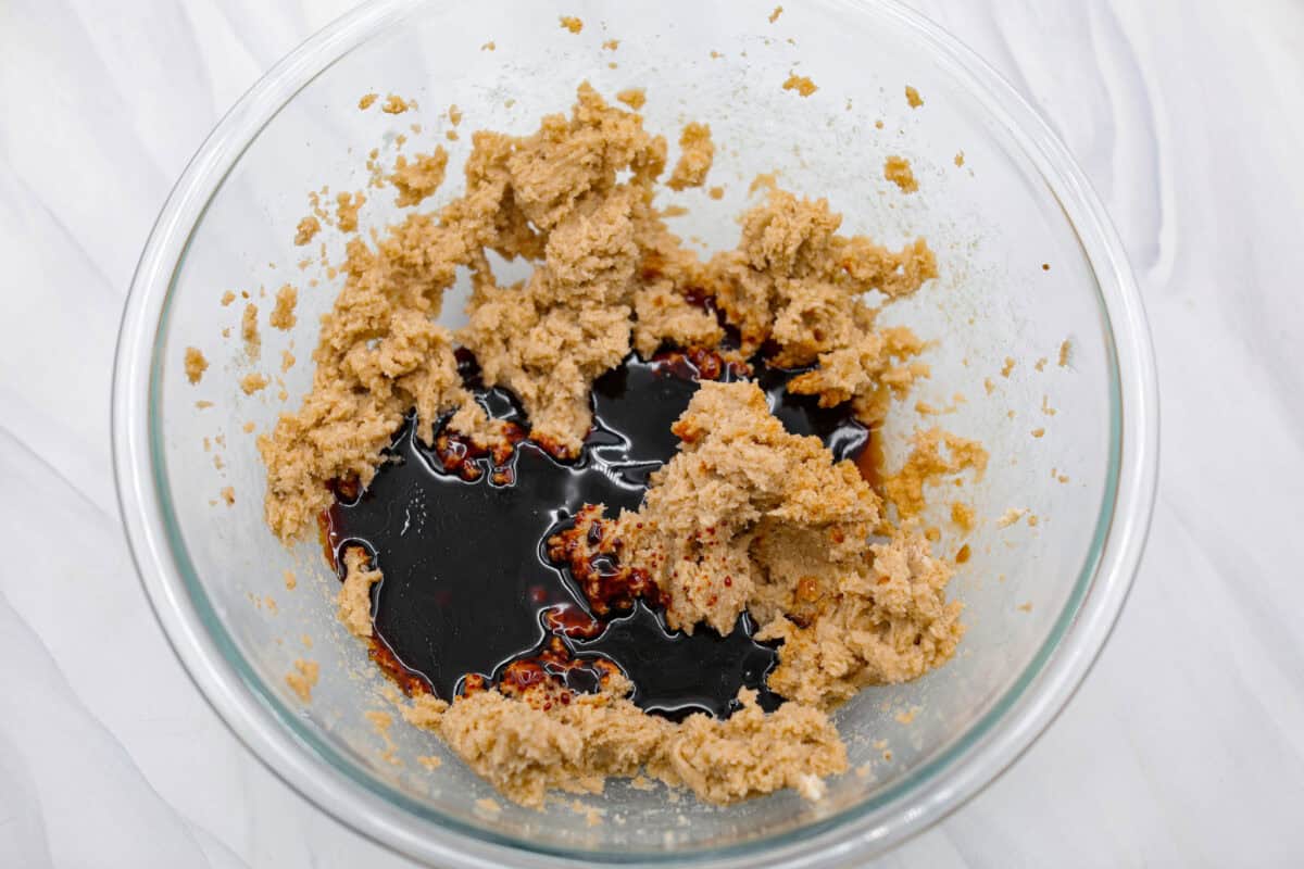 Overhead shot of creamed butter and sugar with molasses added. 