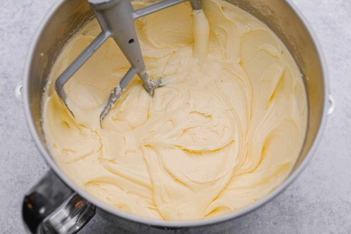 Overhead shot of butter and sugar, eggs, sour cream and extracts all combined. 