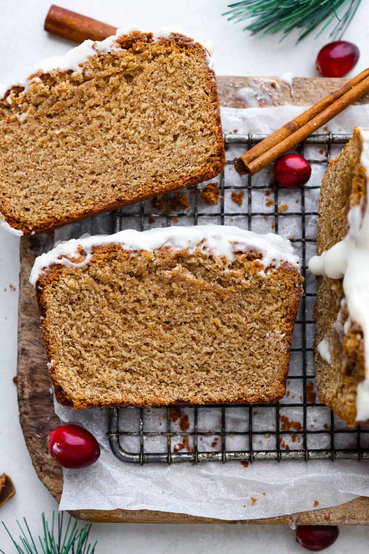 Overhead shot of gingerbread loaf slices on a cooling rack. 