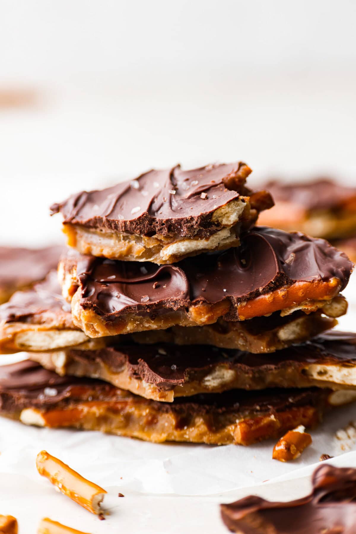 Side shot of a stack of broken Pretzel Christmas crack pieces. 