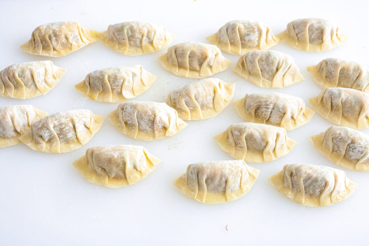 Angle shot of completed dumplings on a countertop.