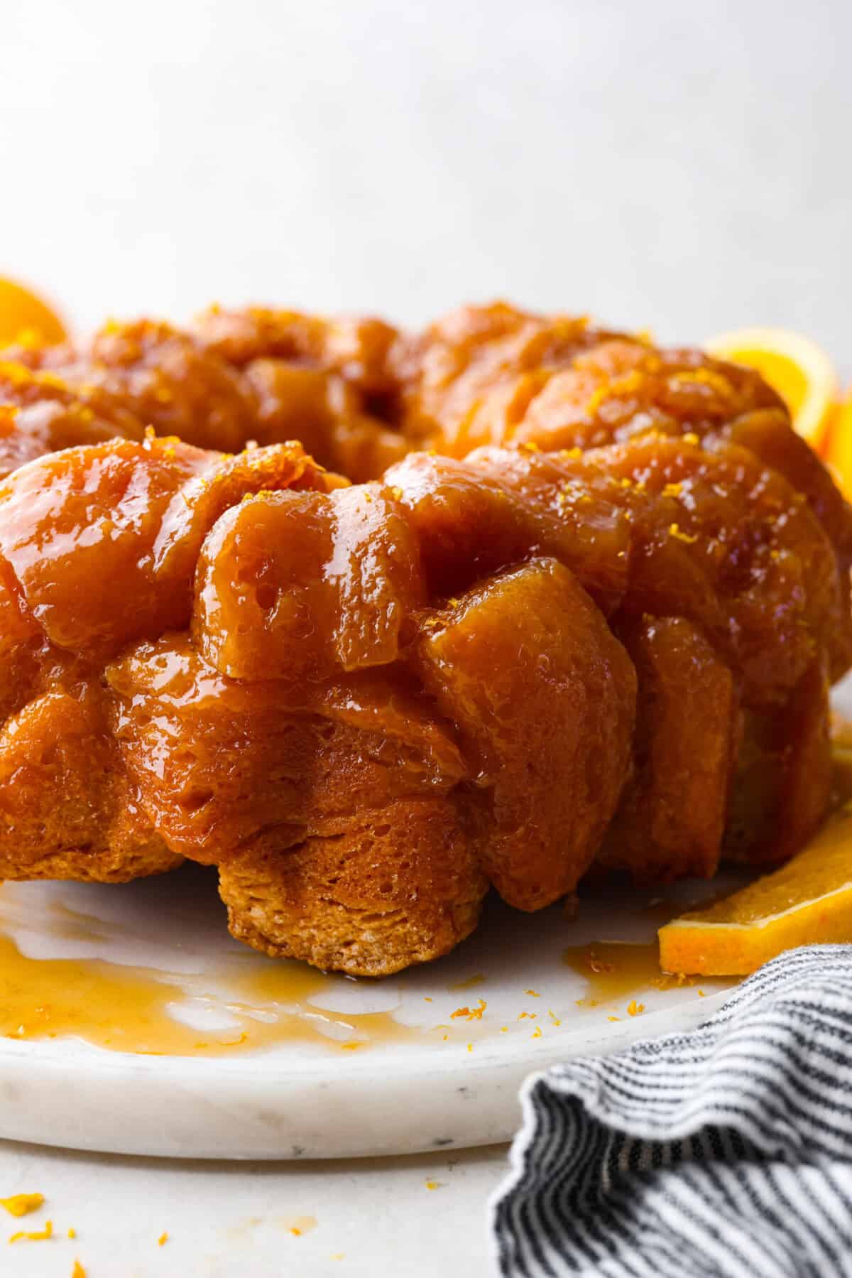 Side shot of orange monkey bread. 