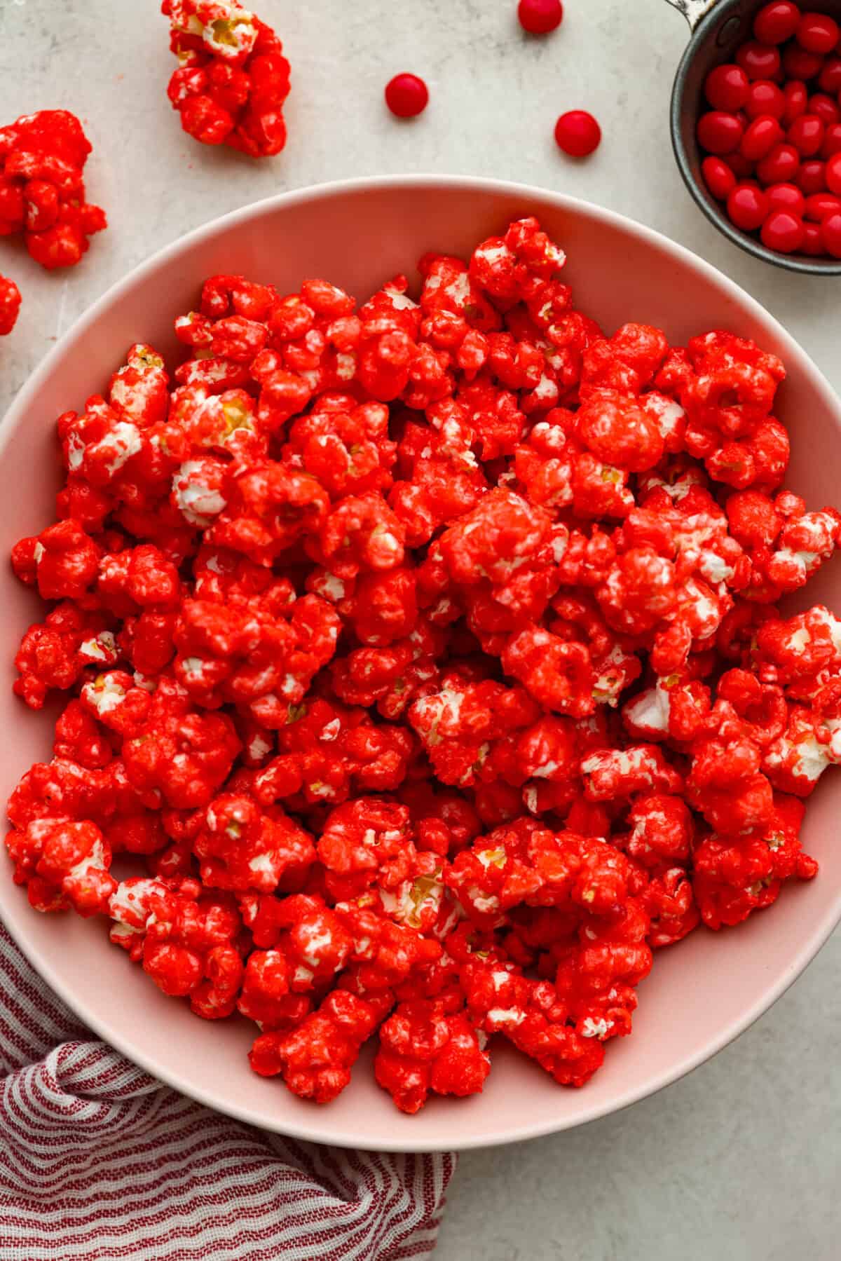 Overhead shot of red hot cinnamon popcorn in a bowl. 