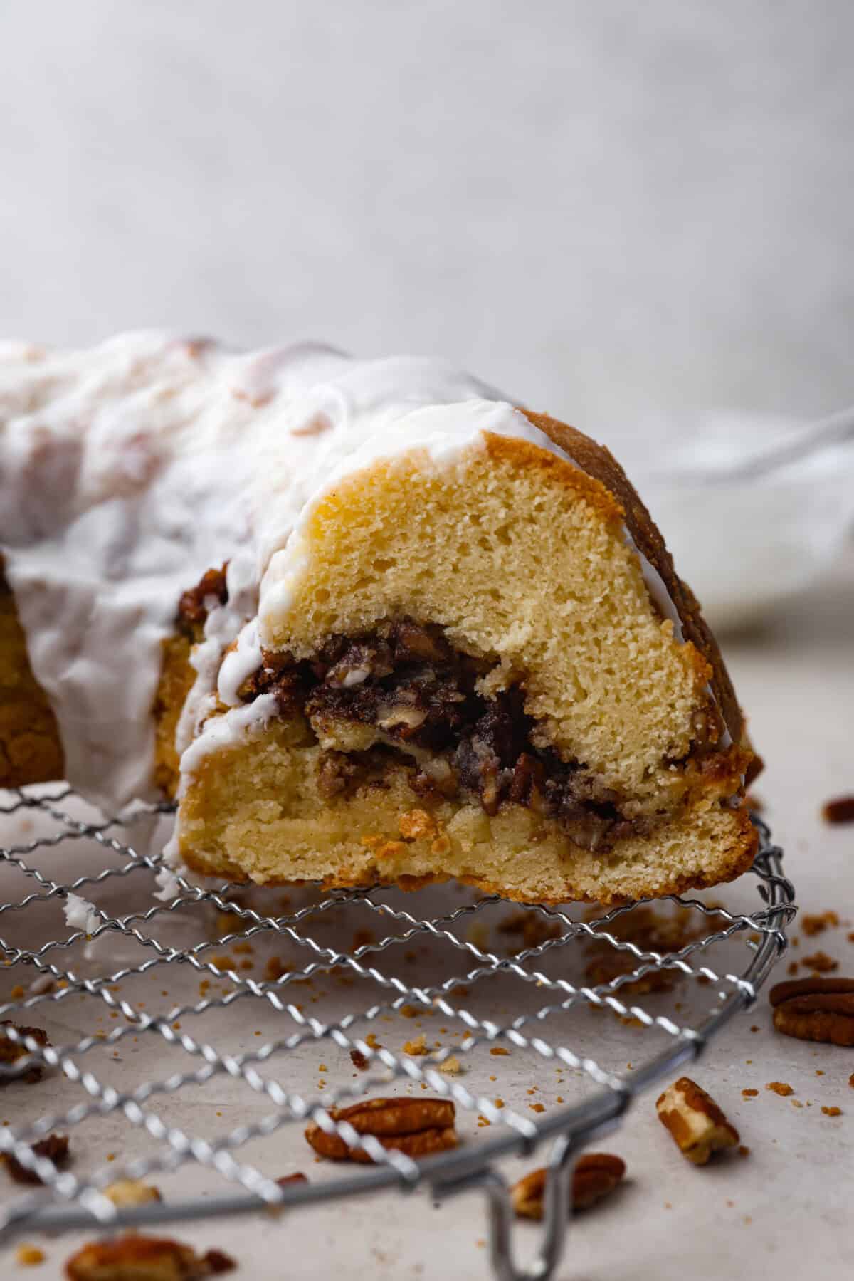 Side shot of sock it to me cake on a cooling rack. 