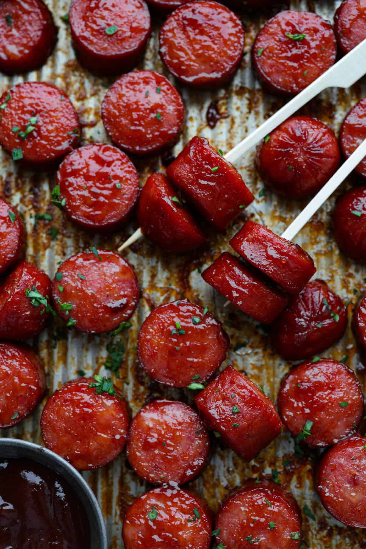 Overhead shot of kielbasa bites on toothpicks. 